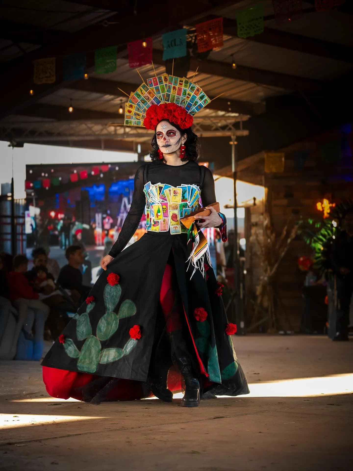 A Catrina in an elaborate gown on the DODFest runway